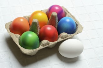 Colourful Easter eggs in packaging, Easter celebration