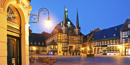 Market square with atmospherically illuminated town hall in the evening, Wernigerode, Harz,