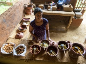Sinhala woman prepares lunch in clay pots, Sri Lanka, Asia