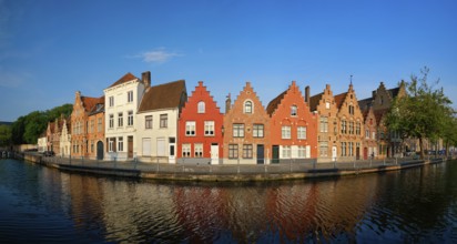 Typical Belgian cityscape Europe tourism concept, panorama of canal and old houses on sunset.