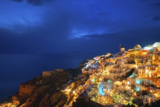 Famous greek iconic picturesque tourist destination Oia village with traditional white houses and