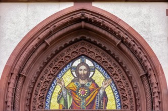 Musical depiction of Jesus Christ in the pointed arch of the main portal of the Church of the