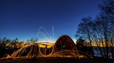 Playing with the steel wool in the hermitage of Agiña at dawn, Navarra