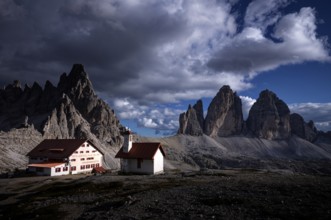 Stormy atmosphere, view of the Three Peaks Hut, chapel, Paternkofel, Three Peaks, South Tyrol,
