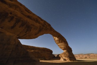 Starry sky above The Arch, also known as Rainbow Rock, near AlUla, Medina Province, Saudi Arabia,