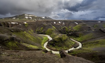 River bend, foot Asgardsa, volcanic landscape with black rocks and green moss, dramatic cloudy sky,