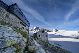 Old and new mountain hut Refuge Albert 1er, high alpine mountain landscape, summit of the Aiguille