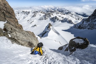 Mountaineer with ice axe and crampons, ascent through steep snowfield to Piz Kesch or Piz d'Es-cha