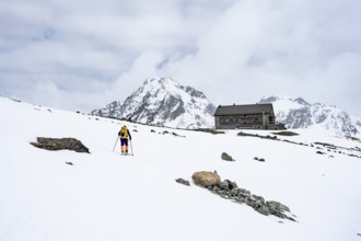 Ski tourer in the mountains in winter, Piz Bever, Chamanna Jenatsch CAS, Swiss Alpine Club hut, Val