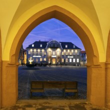 View from the open hall of the late Gothic town hall in Goslar in the evening onto the market
