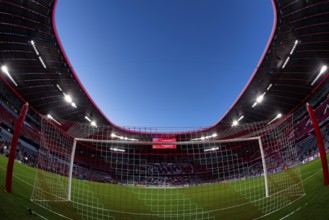 Overview, interior, floodlit match, behind-the-goal perspective, goal net, blue hour, fisheye shot,