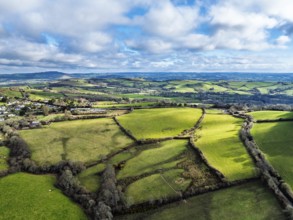 Farms over Morcombelake Village from a drone, Bridport, Dorset, England, United Kingdom, Europe