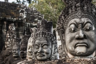Figures on the bridge to Angkor Thom, sunset, Angkor Wat, Angkor, UNESCO World Heritage Site, Siem
