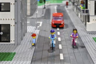 Lego figure with bicycle