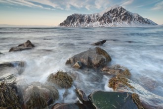 Long exposure, winter evening mood at Skagsanden, washed over stones, near Flakstad, Flakstadøy,