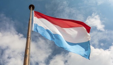 Flags, the national flag of Luxembourg flutters in the wind