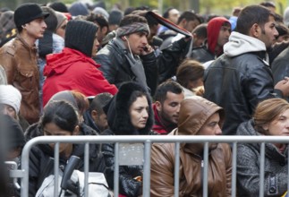 Refugees from Syria waiting to be registered at the Central Reception Centre for Asylum Seekers at