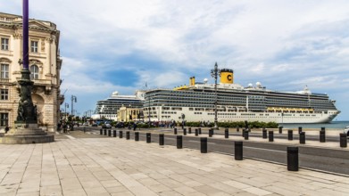 Piazza Unità d'Italia borders directly on the sea with cruise ships, Trieste, harbour city on the