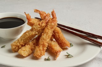 Fried shrimp, peeled in tempura, soy sauce, close-up