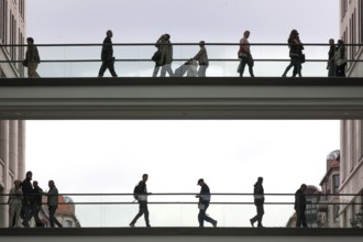 Families cross a bridge with their children into the Mall of Berlin shopping centre, 25/09/2014,