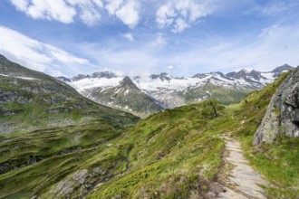 Hiking trail in picturesque mountain landscape, mountain peaks with snow and glacier Hornkees and
