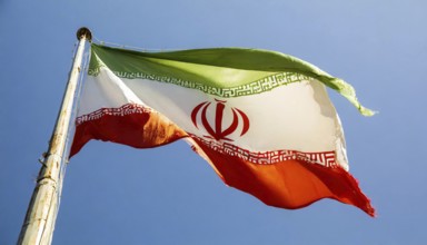 Flag, the national flag of Iran flutters in the wind