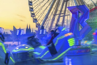 Deutz funfair on the Rhine, at Easter, funfair, break-dancer ride, Ferris wheel, Cologne Cathedral,