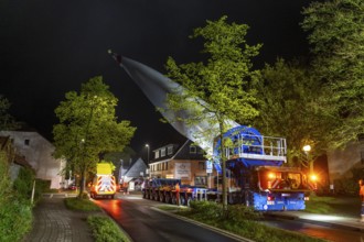 Transport of a 68 metre long, 22 tonne blade of a wind turbine, here in Breckerfeld-Waldbauer, with