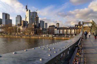 Skyline of the city centre of Frankfurt am Main, river Main, Eiserner Steg bridge, dusk, Hesse,