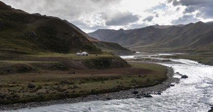 Yurt by a river, Desolate mountain landscape, Tian Shan, Sky Mountains, Sary Jaz Valley,
