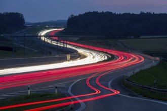 Tracers on the A8 motorway, winding road, evening, long exposure, Swabian Alb, Baden-Württemberg,