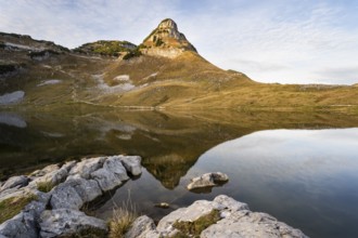 Lake Augstsee and the Atterkogel mountain on the Loser. Autumn, good weather, blue sky, little