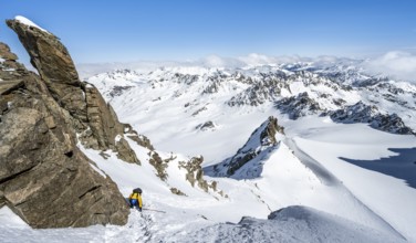 Mountaineer with ice axe and crampons, ascent through steep snowfield to Piz Kesch or Piz d'Es-cha