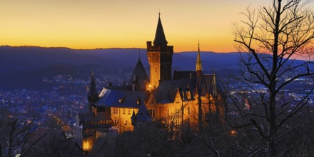 Atmospheric view of the illuminated Wernigerode Castle at sunset, Harz Mountains, Saxony-Anhalt,