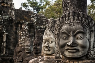Figures on the bridge to Angkor Thom, sunset, Angkor Wat, Angkor, UNESCO World Heritage Site, Siem