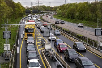 Weighing and barrier system on the A42 motorway, in front of the dilapidated motorway bridge over