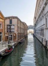 Venetian gondolas on the Rio di Palazzo canal with Bridge of Sighs, Venice, Veneto, Italy, Europe