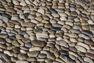 Detailed view of an area paved with different coloured pebbles, Knights Street, Rhodes Old Town,