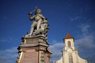 Duke Eberhard Ludwig Monument, behind it the Catholic Church of the Most Holy Trinity, Ludwigsburg,