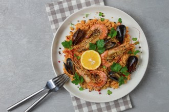 Seafood paella, shrimp and mussels risotto, rice, homemade, top view, no people