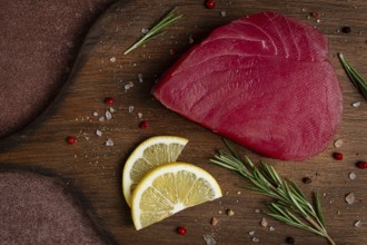Fresh red tuna fillet, for steak, raw, top view, on a cutting board, no people