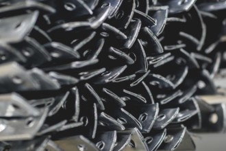 Finished galvanised steel parts lie in the factory hall of the surface finishing company Coatinc