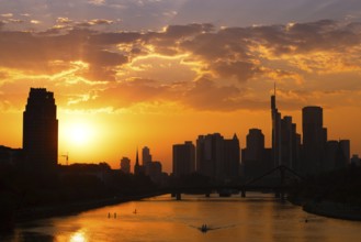 The sun sets behind the Frankfurt banking skyline, Frankfurt am Main, Hesse, Germany, Europe
