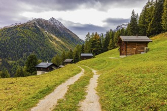 Alpine huts above Grimentz, behind the summit of Corne de Sorebois, Val d'Anniviers, Valais Alps,