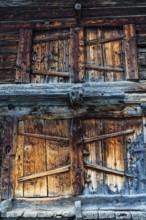 Weathered loading doors of an old hay barn, Grimentz, Val d'Anniviers, Valais Alps, Canton Valais,