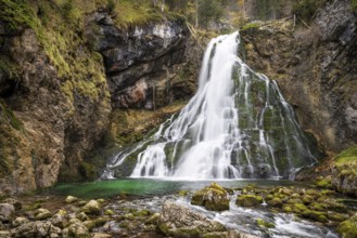 The Golling waterfall (Schwarzbachfall, Schwarzenbachfall) in autumn. Rocks with moss. Tennengau,