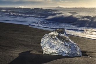 Ice floe on the beach, waves, sunny, morning mood, winter, Diamond Beach, Breidamerkursandur,
