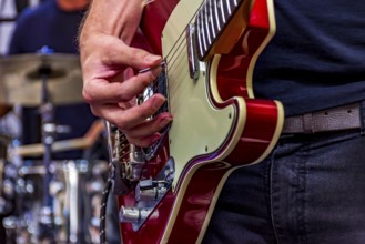 Guitarist on stage playing his instrument during a show, Belo Horizonte, Minas Gerais, Brazil,