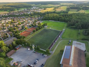 Aerial view of a village with a large sports field, football pitches and tennis courts, Gechingen,