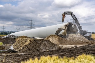 Demolished tower of a 20 year old wind turbine, in the Werl wind farm, 5 old Enercon E-66 turbines